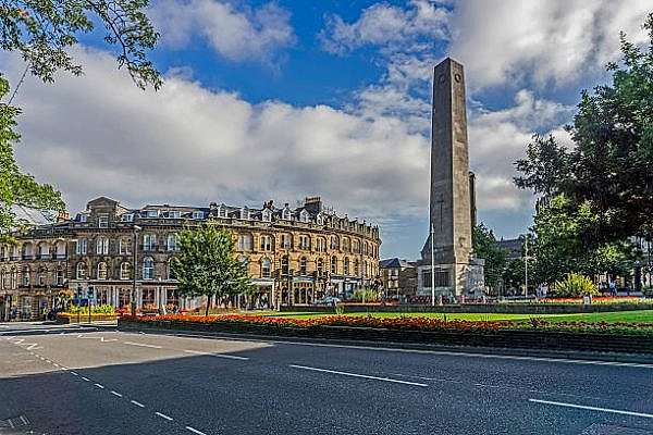 Harrogate, UK - August 24, 2016: View of Harrogate Town Center, Yorkshire. Shops can be seen and people can be seen walking on the pavements.
